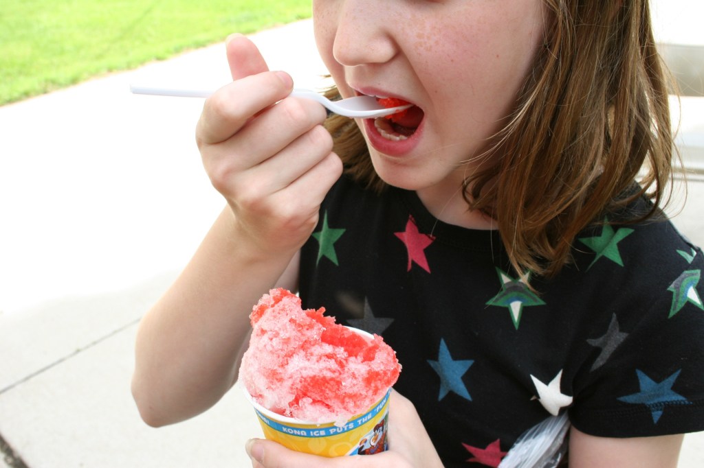 Enjoying her Kona Ice.