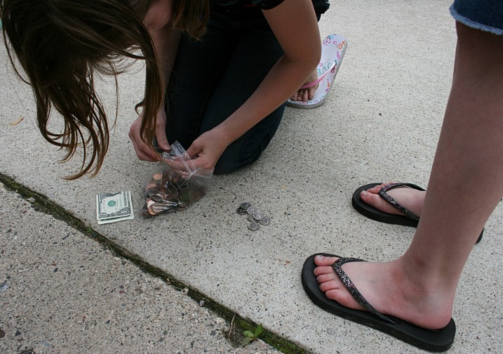 A dollar bill and coins for a treat.