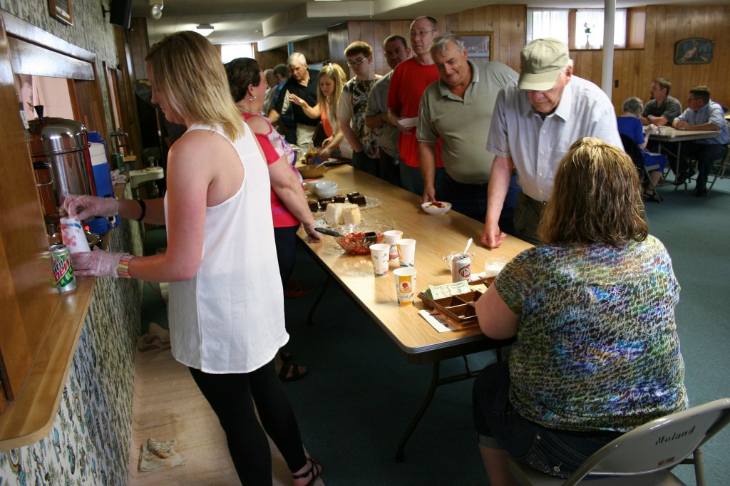 Diners file through the food serving line.