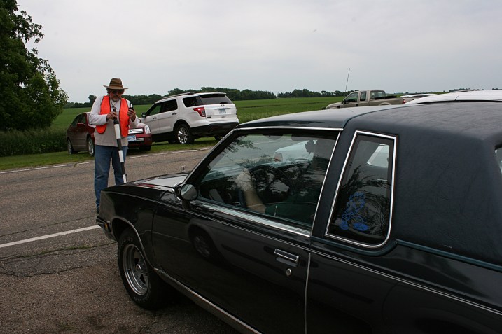Volunteers guide motorists into parking spaces outside the country church.