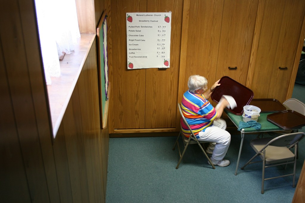Georgia Vincent wipes down trays.