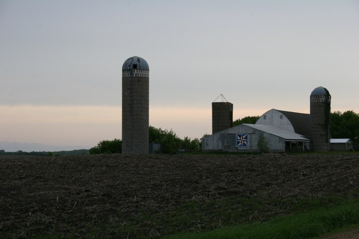 The sun sets as I approach Barb and Bob's farm east of Faribault.