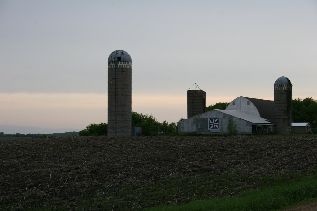The sun sets as I approach Barb and Bob's farm east of Faribault.