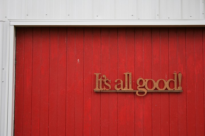The message on the granery door reflects Barb's attitude: "The sheds are full of stuff and it's all good."