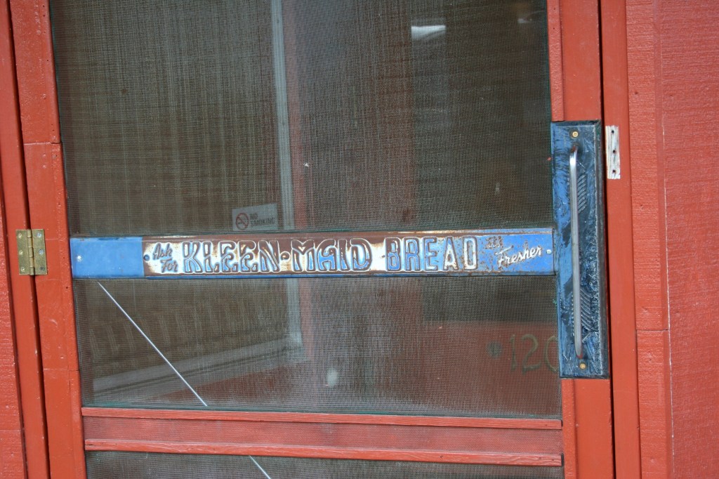 Love this original signage on the old screen door that bangs behind you at
