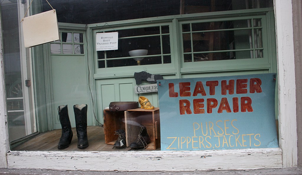 Window displays and signs are equally as interesting as the architecture.