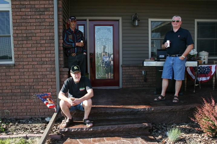 The men gathered to grill burgers and brats and...
