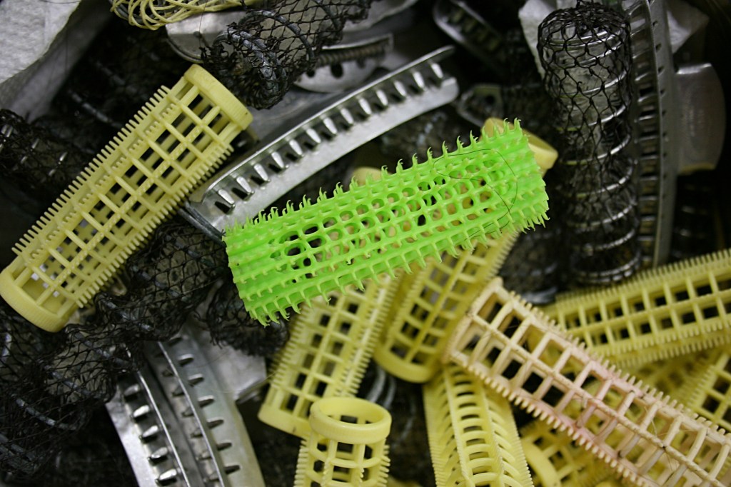 I have not seen curlers like this in 40 years, just like my mom used and occasionally poked into my head. The plastic pins for securing the rollers are included.