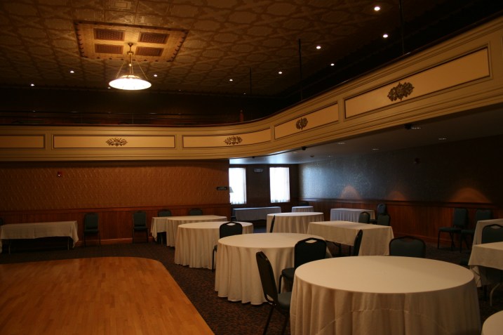 Another view of the same room shows the balcony and the seating area below.