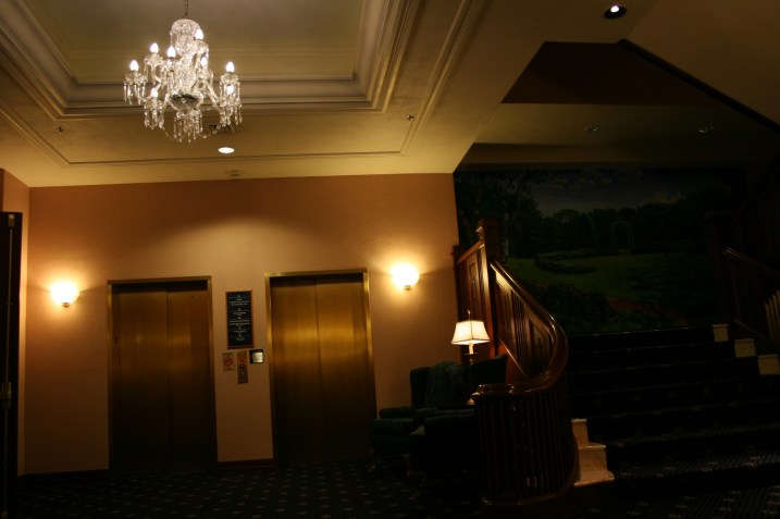 The relocated grand stairway and a mural featuring the gardens on former hotel owner, Chicago philanthropist Helen Basler. Today the hotel is owned by Northfield, Minnesota-based Rebound Hospitality.
