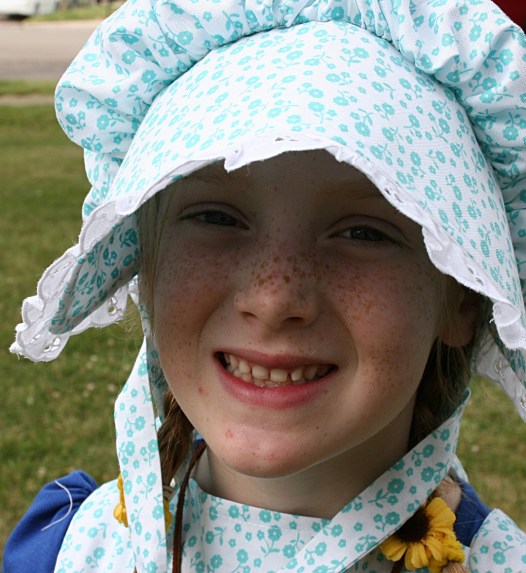 Too young for the Look-A-Like contest, but still outfitted in prairie girl clothing.