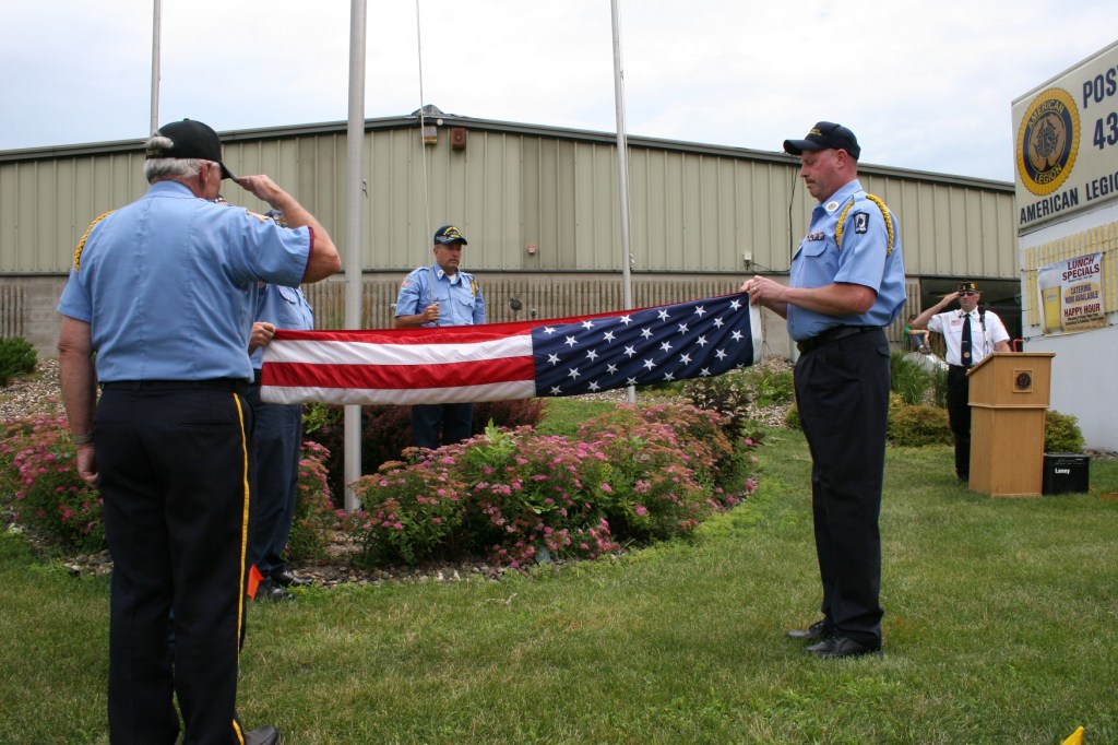 The respectful process begins of properly folding the U.S. flag.