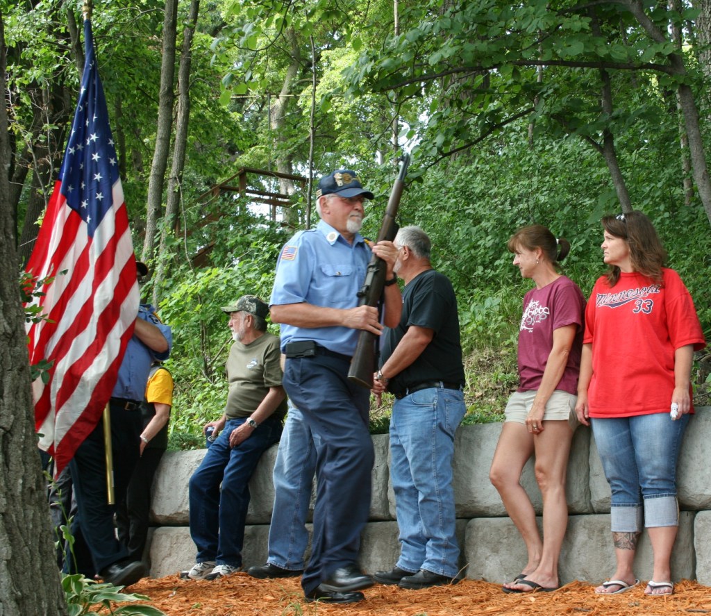 Veterans arrive with flags and guns to start the dedication program.