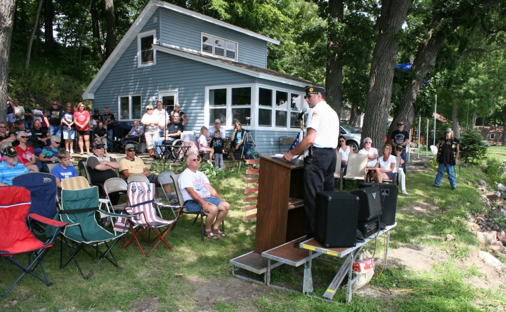 Faribault American Legion Post 43 Commander Kirk Mansfield speaks before the unveiling.