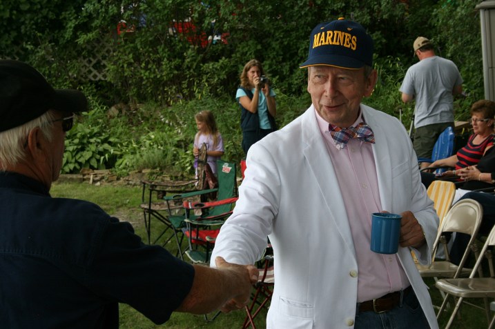 Friends greet friends before the dedication begins.