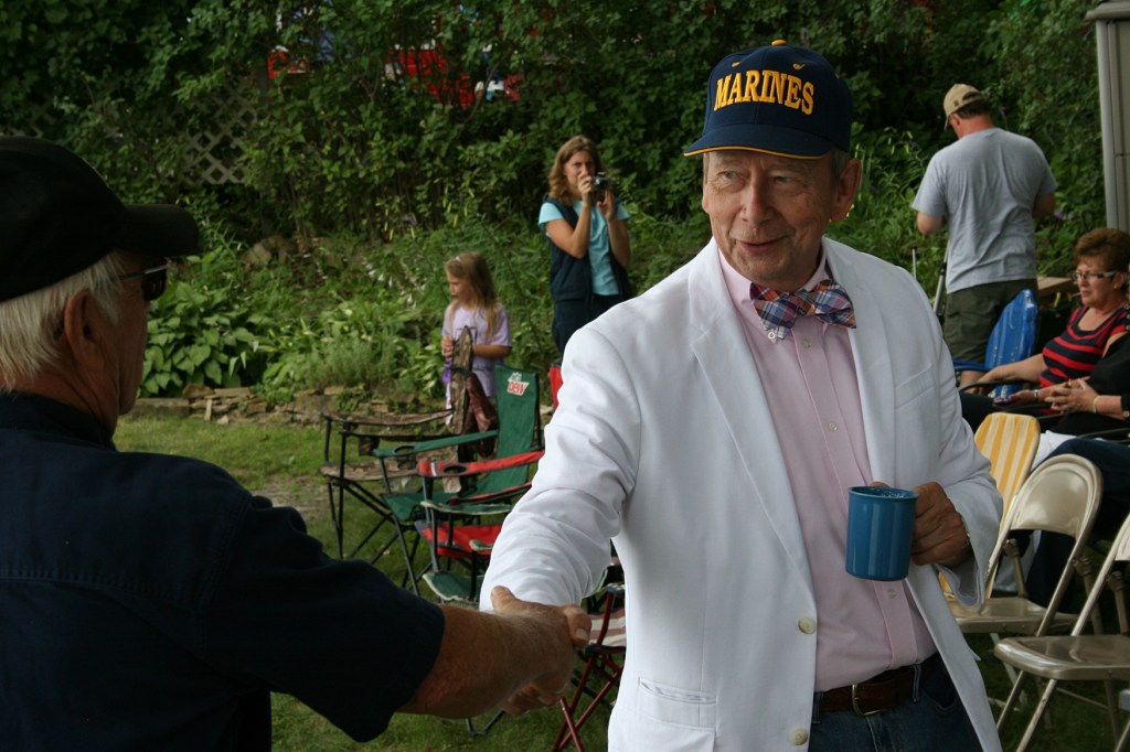Friends greet friends before the dedication begins.