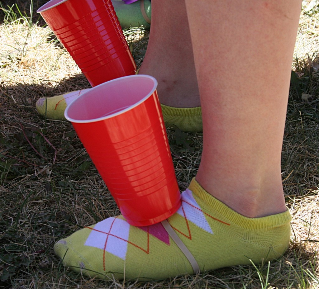 Colorful socks, colorful cups for this contestant in a race to fill the cups with popcorn.