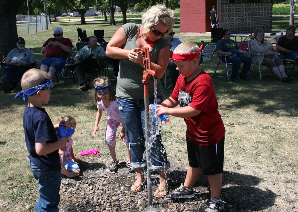The water spigot proved a popular spot once squirt guns were distributed.
