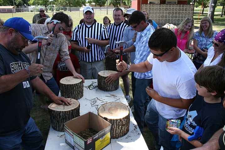In the nail driving contest, entrants had one minute to pound as many nails as they could into a section of wood.