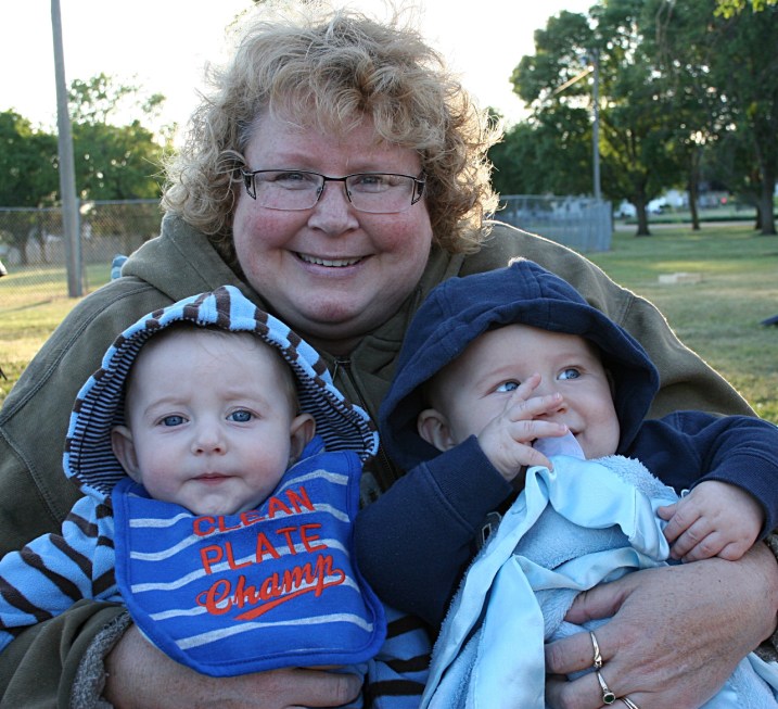 My sister Lanae cuddles 5-month-old cousins Garrett (I think; he's a twin), left, and Logan, right. They represent the next generation of competitors.