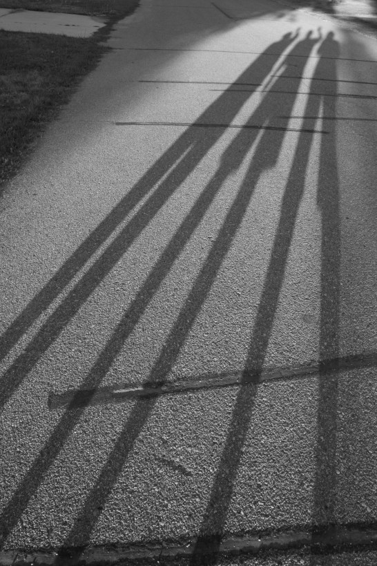 The shadows of my 81-year-old mom, left, my husband in the middle and me on the right.