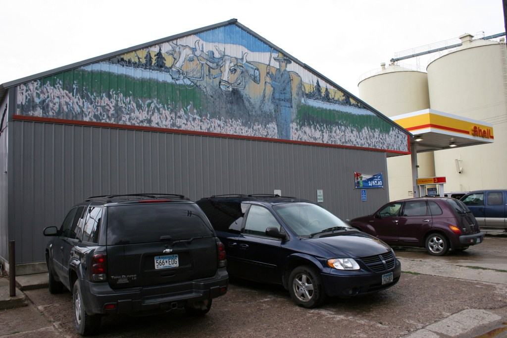 A rural-themed mural on the side of Wayne's C-Store.