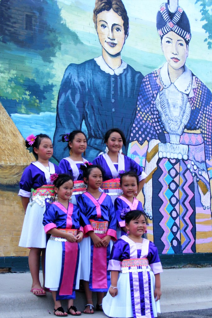 Girls in traditional Hmong dress attended the mural dedication last year.