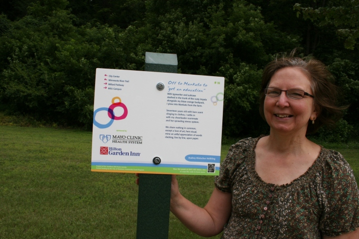 Me, next to my "Off to Mankato to 'get and education'" poem posted near Glenwood Gardens.