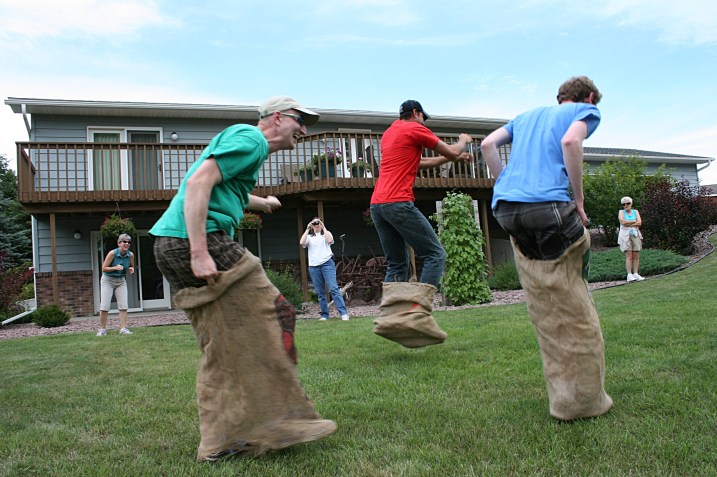 Cousins and a cousin-in-law going strong in the gunny sack race until...