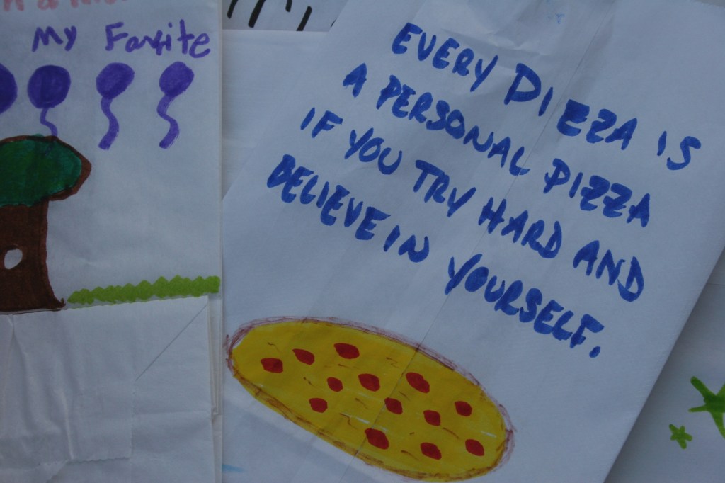 We all designed luminaries, including this one by my nephew-in-law Jason with his favorite quote, one that sits on his work desk.