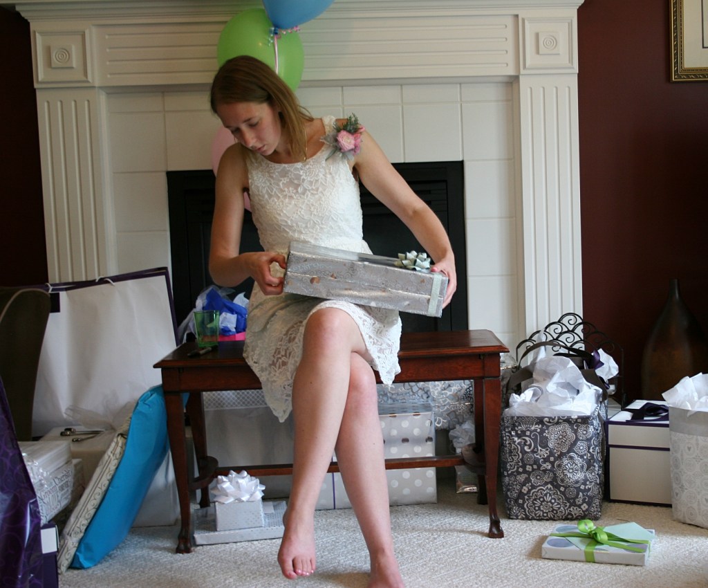 The bride-to-be opens gits.