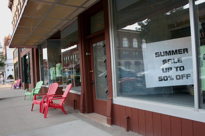 Chairs invite customers and passersby to sit a spell outside St. Clair's for Men and Owatonna Shoe.