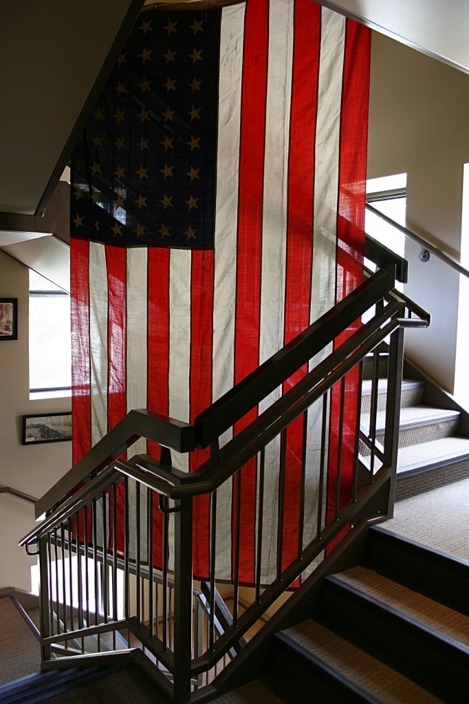 A flag hangs in a hallway outside the military museum.