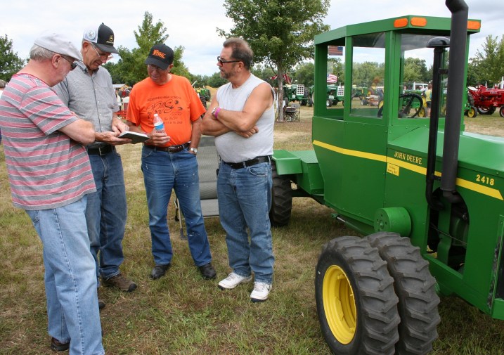Immersed in tractor talk.