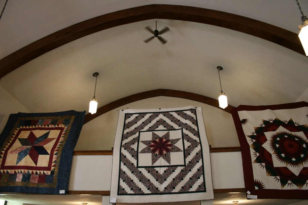 Among the incredible quilts were these three hung from the balcony.