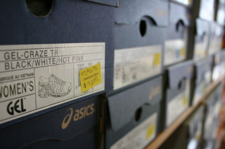 Stacked boxes of shoes fill the store.