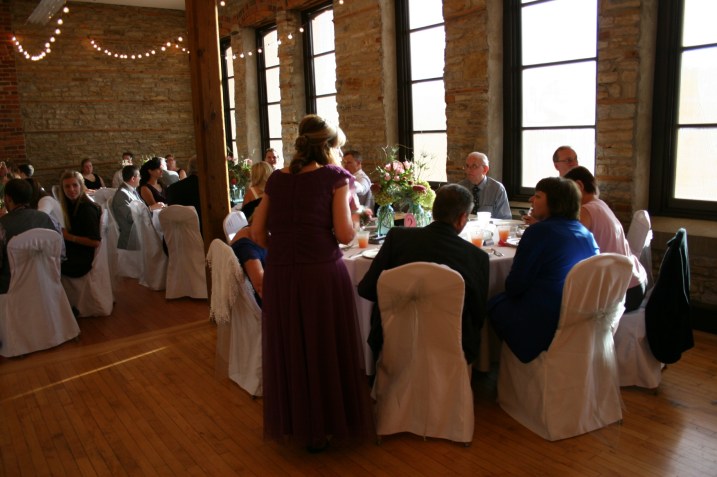 Eleven round tables, which will seat up to 10, filled the reception space. The groom's parents and grandparents and other family members were seated at the table in the foreground.