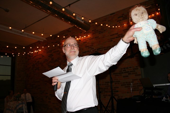 My husband and I agreed that he should use several props to make his speech memorable. Here he pulls out Amber's favorite childhood doll, Sal, whom she dragged everywhere. Randy introduced the groom to Sal before handing over Amber's treasured doll. 