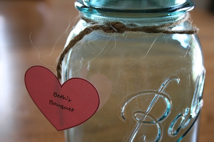Vintage blue canning jars have been rented and readied for bridal party and table bouquets.