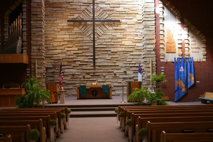 Trinity Lutheran Church, decorated with ferns from my friend, Mike, and with hydrangea pew flowers created by my floral designer sister. Trinity is our family's church, where the bride was baptized and confirmed and attended Christian Day School.