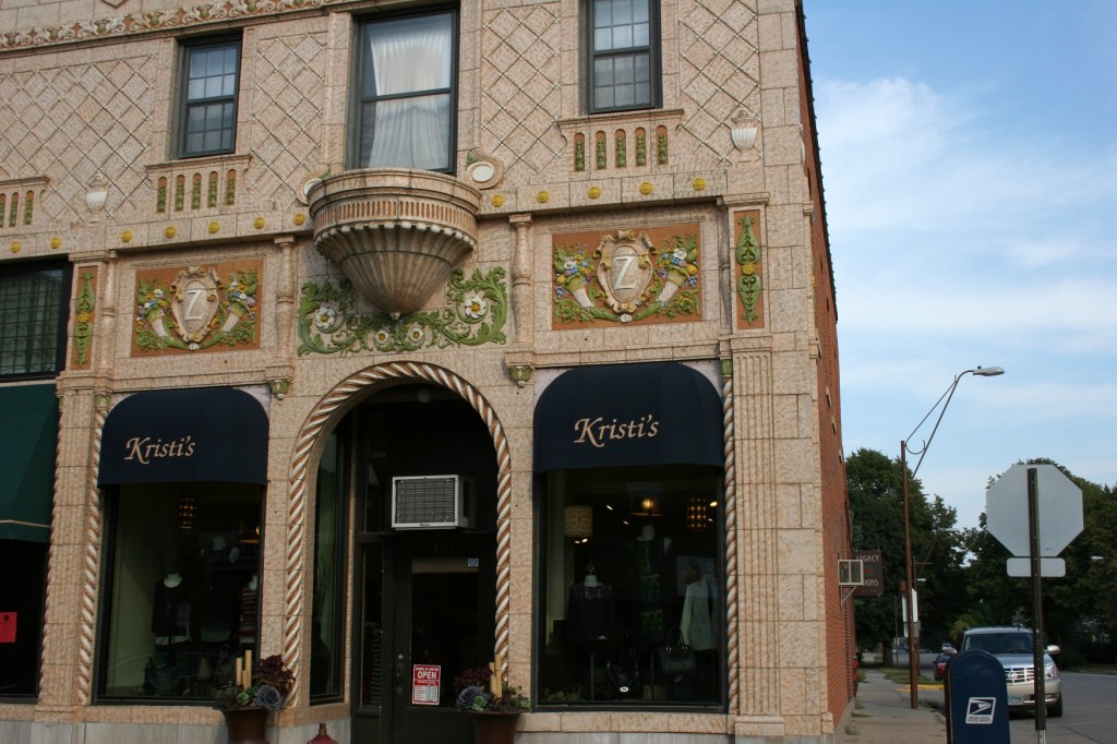 I love beautiful historic architecture. Driving by Kristi's Clothing in downtown Owatonna, I zipped down the window and shot this image of one splendid detailed building.