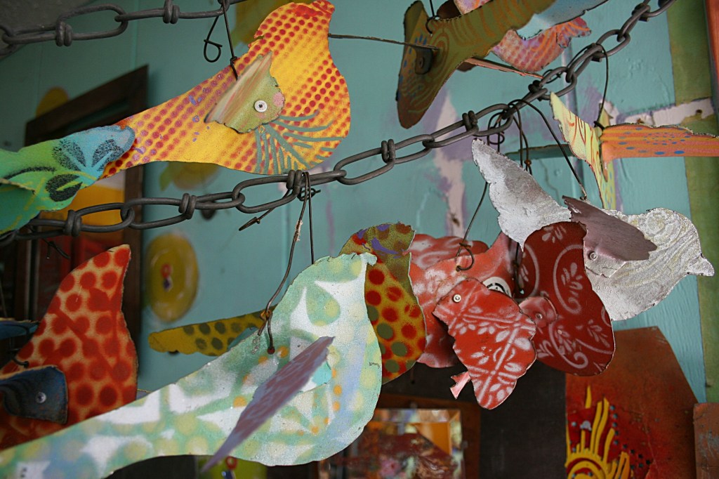 Birds cut from a filing cabinet and spray painted.