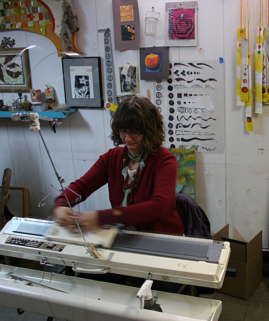 Artist Ian Baldry of St. Louis Park creates a scarf on her knitting machine.