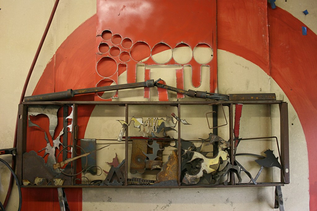 Wolcott's political statement art sectioned like a cartoon.