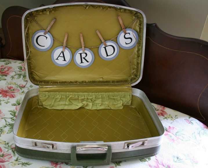 And then the jute string of letters was hot glue gunned inside the bride's dad's vintage 1970s suitcase.