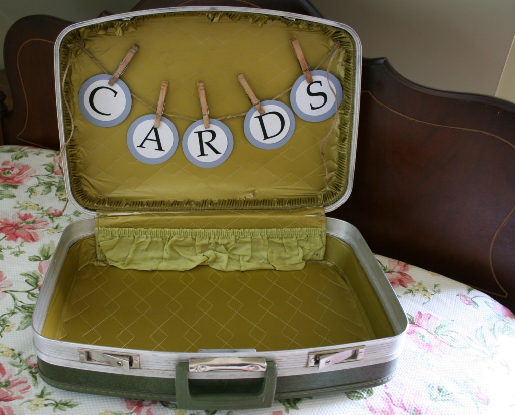 And then the jute string of letters was hot glue gunned inside the bride's dad's vintage 1970s suitcase.