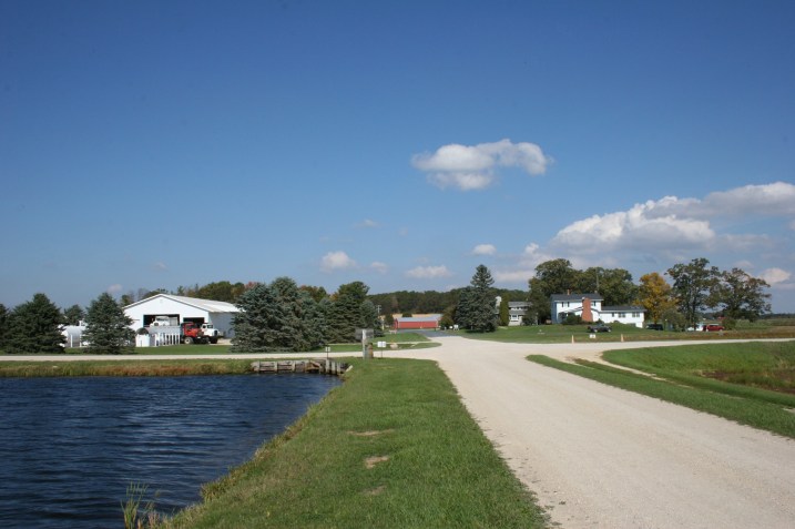 In the distance lies the farm site; to the right the cranberry fields; and to the left, the lake/water for flooding the fields.