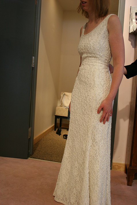 Once the dress, a second-hand vintage replica gown, was chosen, Nikolina helped Amber envision the dress redone to suit Amber. She suggested adding a sash, which was the perfect addition to emphasize Amber's tiny waist and update the dress.