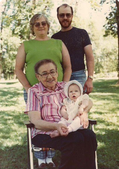 Four generations: Great Grandma Katherine Simon holding my daughter, Amber, with my mother-in-law behind them beside my husband, Randy. Photo taken in July 1986 at a family picnic, Pierz, Minnesota.