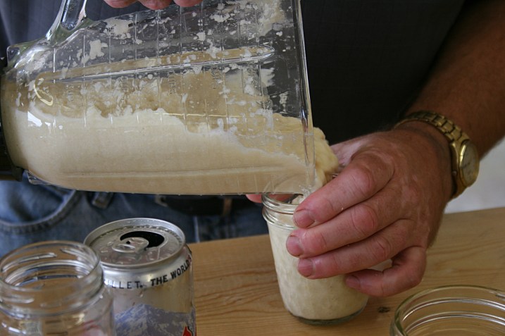 Once blended to just the right consistency with the correct amount of vinegar, the horseradish is poured into jars.